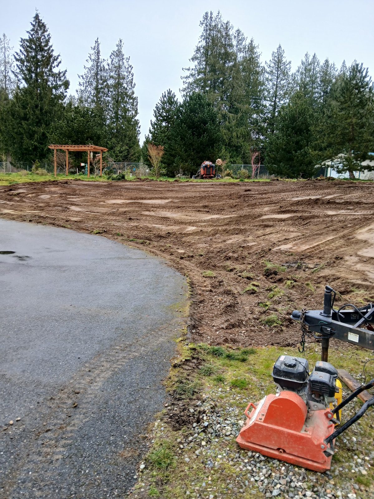 Yard graded and prepped for new topsoil and sod
